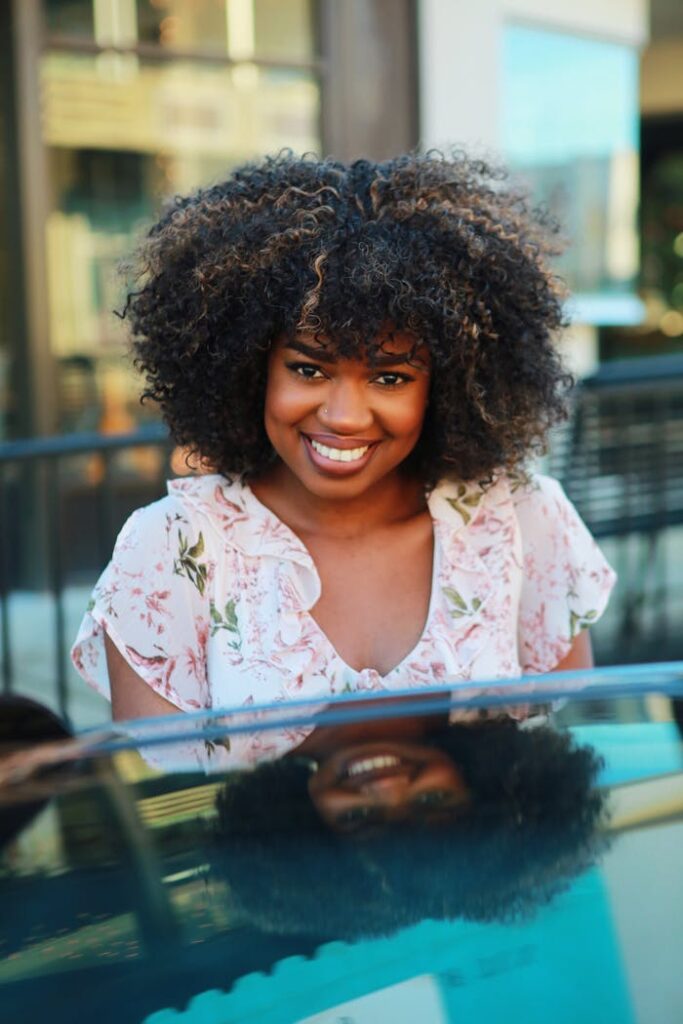 Standing Woman Smiling Wearing Floral Blouse